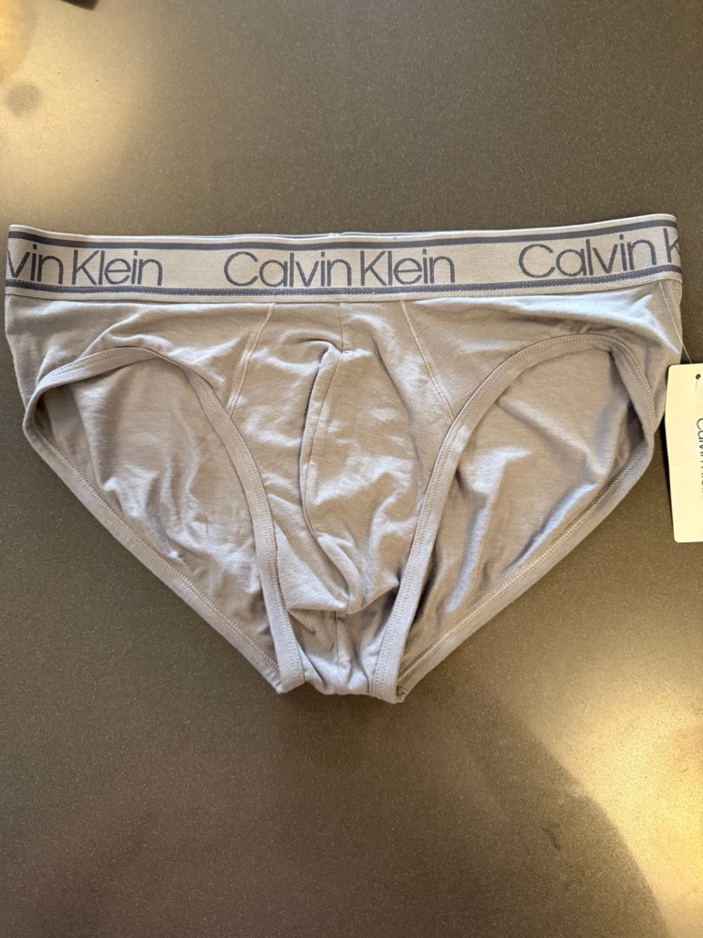 New Calvin Klein Light Gray Men's Hip Briefs with Logo Waistband. Viscose blend